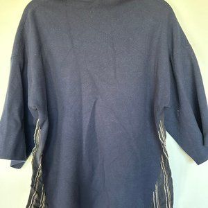 1/2 turtleneck, 3/4 sleave, jersey material with blouse material at the back top